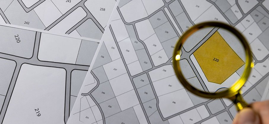 Maps of zoning area numbers and a magnifying glass