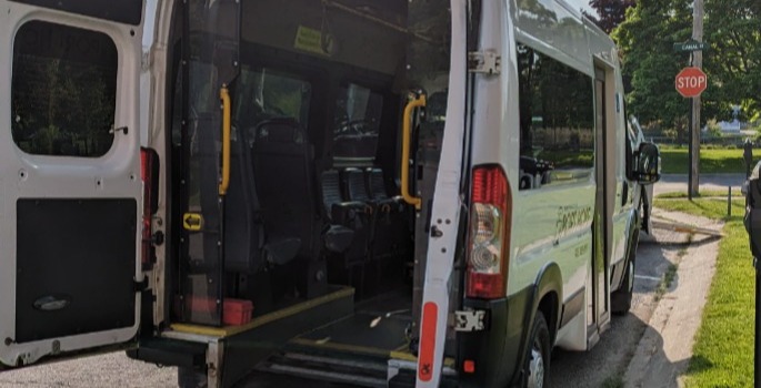 Transit bus with back door open