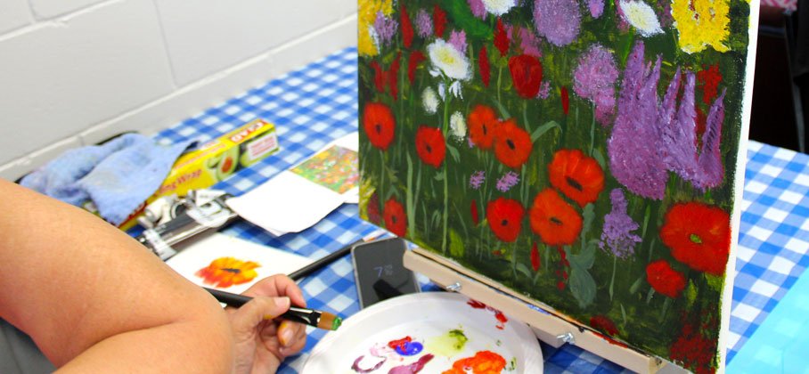 flower canvas painting on checkered table cloth
