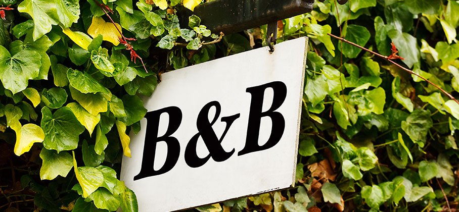 Image of B and B sign with foilage