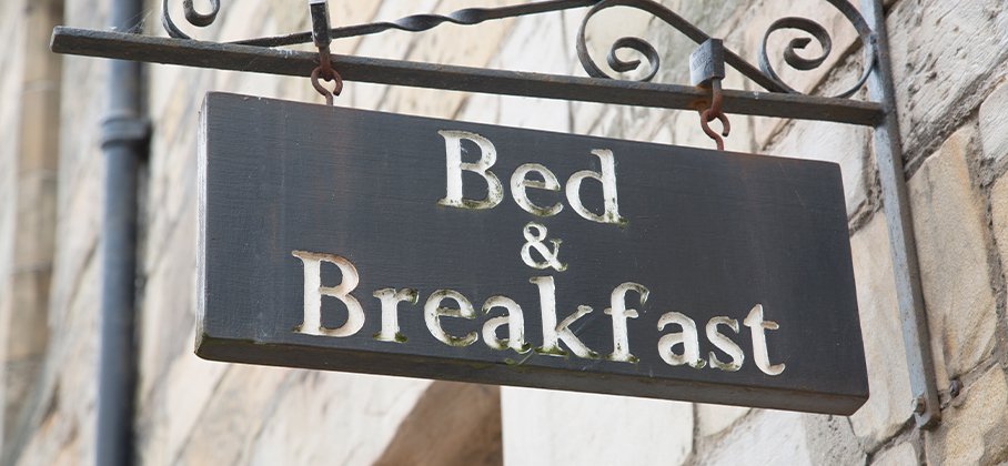Bed and Breakfast sign on building facade