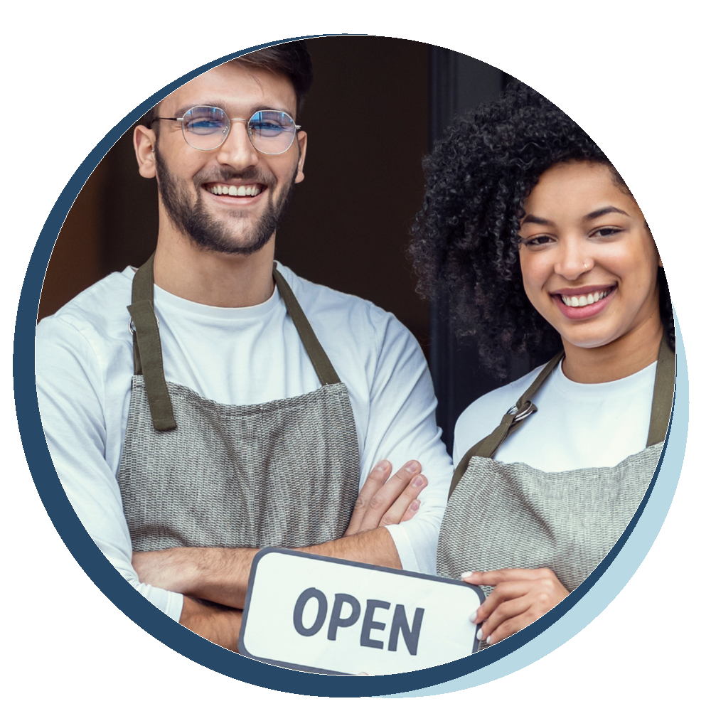 Two business owners with an open sign