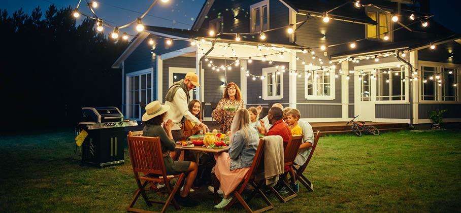 Family having and outdoor dinner in backyard