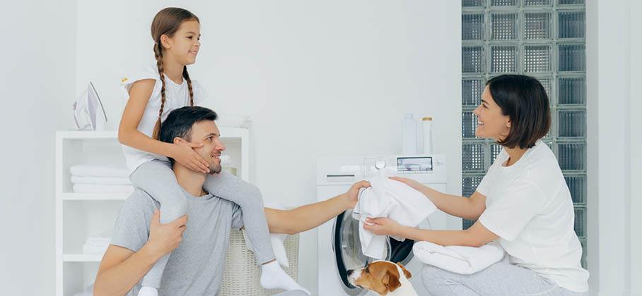 family folding laundry