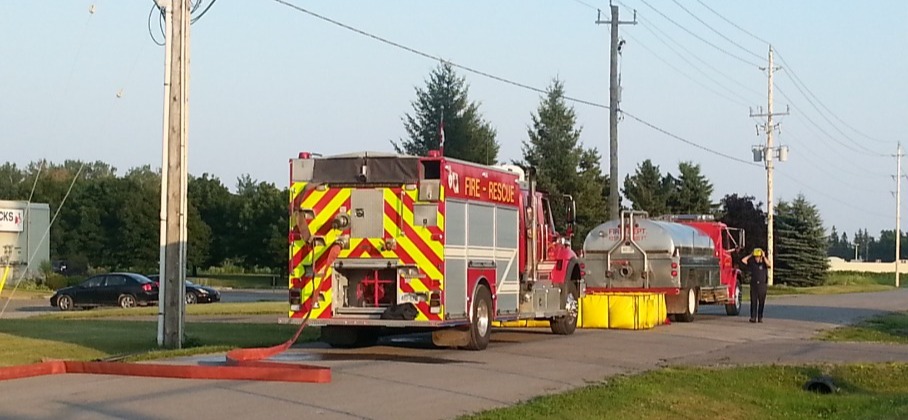 Fire hose attached to a pumper truck 