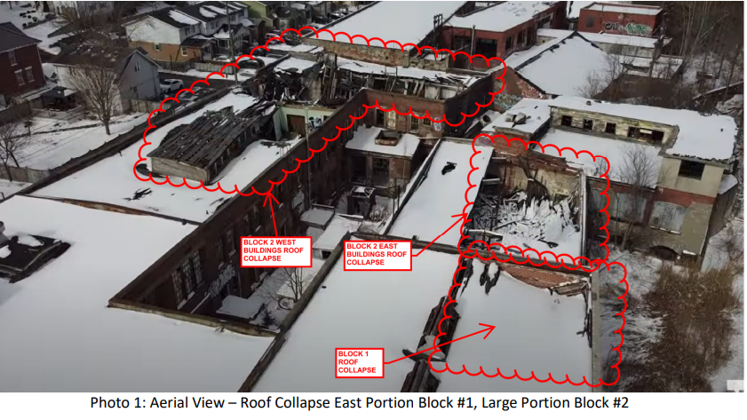 Aerial view of building with red markings demarking blocks 1 and 2