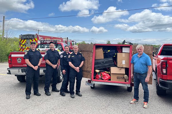 Fire Chief Ogden, Deputy Chief McCurdy and Members of Port Hope Fire with Carl Eggiman from Firefighters Without Boarders Canada