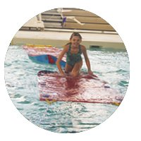 Girl on the water walkway in the pool