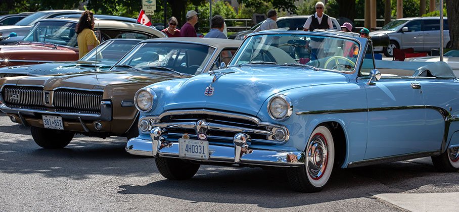 vintage cars parked together