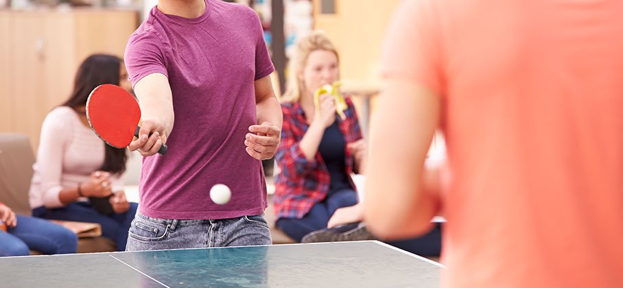 Youth playing ping pong