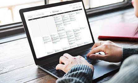 Image showing an online calendar displayed on a laptop screen.