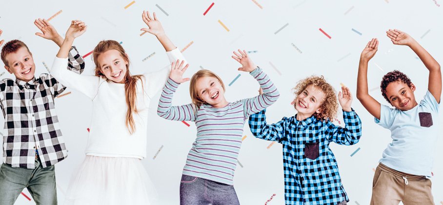 Group of children jumping and smiling