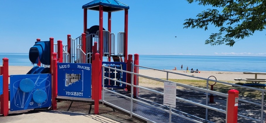 playground equipment including a slide and music wall