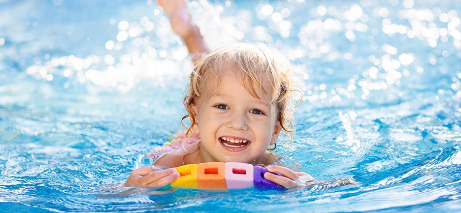 Child Swimming in a Pool