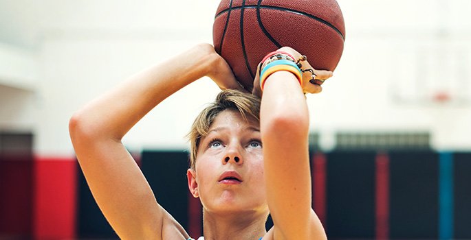 Youth boy shooting a basketball