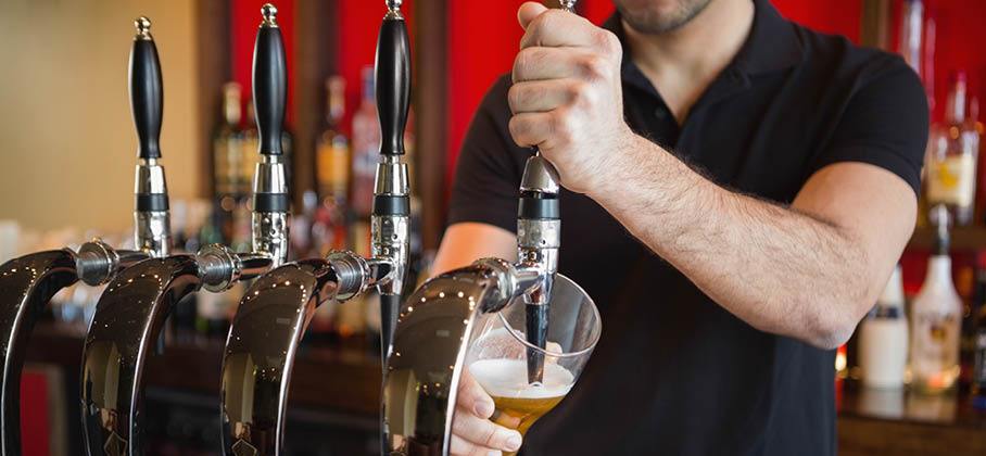 Image of Bartender pouring a beer